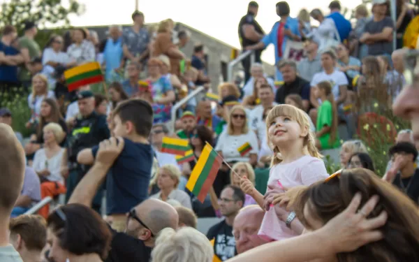 A Lithuanian girl in a crowd celebrating their statehood day