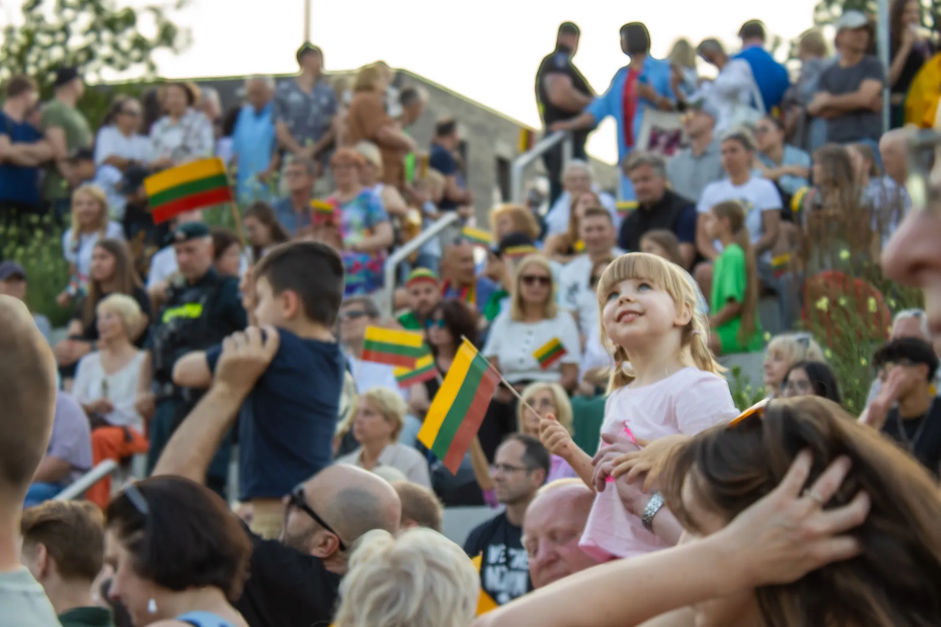 A Lithuanian girl in a crowd celebrating their statehood day